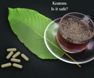 Kratom powder and dried leaves, marketed for natural pain relief